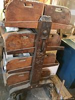 Front view of metal frame with six removable wooden trays