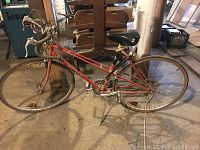 Full side view of the Matsuri ladies road bike showing frame, tires, handlebars, and seat, in dusty condition.