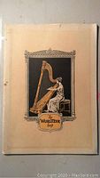 Front cover of 'The Wurlitzer Harp' book featuring a woman playing a harp illustration