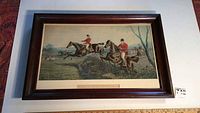 Frontal image of the framed art showing entire print with hunting scene and walnut frame.