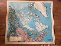 Full view of the 49" x 44.5" framed vintage relief map of Canada showing detailed topography and color-coded land areas.