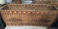 Front view of rectangular woven basket showing overall shape and pattern