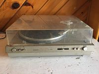 Full view of Pioneer PL-520 turntable with clear dust cover showing condition and controls on front panel.