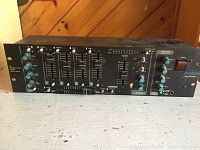 Front view of vintage Furman DJM-8 mixer showing multiple input sliders, knobs, effect loop, headphone jack, and brand labeling.