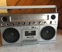 Front view of vintage Zenith boom box showing speakers, cassette deck, and controls.