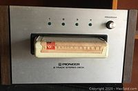 Front view of vintage Pioneer 8 Track Stereo Deck with 8 track cartridge inserted and program indicator lights.