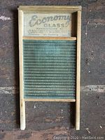 Full view of the antique washboard showing wooden frame and glass scrubbing surface