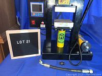 Overall view of hydraulic press, hand pump, hose and fittings