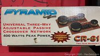 Box showing branding and product details: Pyramid universal three-way adjustable passive crossover network, 400 watts peak power, pair, model CR-81.
