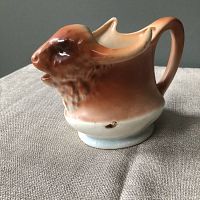 Side view showing buffalo head profile, handle as horn, and chipping on side