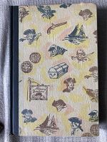 Cover of the vintage book with pirate-themed illustrations including ships, treasure chests, pistols, and pirate portraits