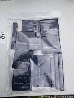 Photo showing multiple boxed Youngblood mineral cosmetics from above in plastic bag.
