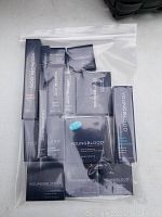 Youngblood mineral makeup cosmetics in sealed boxes in a clear zipper bag.