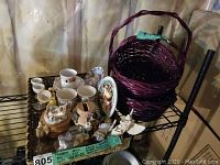 Wide view of assorted decorative items and baskets on black metal shelving unit