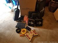 Photo showing entire lot of martial arts training gear including pads stacked to show Century branding, nun chucks, gloves, belts, and target.