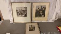 Three framed colored etchings depicting scenes of Rothenburg ob der Tauber, Germany