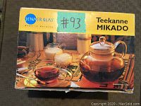 Box of the Jenaer Glas Mikado teapot showing the brand name and product image.