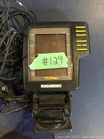 Humminbird TCR ID I fish finder front view showing the screen and attached cables with inventory sticker #129.