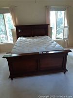 Assembled bed frame with mattress front view