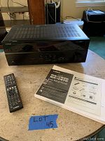 Overview of receiver, remote and manual on tabletop