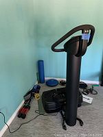 Front view of Zen Pro vibration machine with padded handlebar and base platform