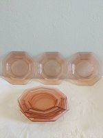 Set of six octagonal pink plates laid out with three standing and three stacked showing all plates in the lot.