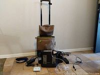 Overview with tan canvas wheeled carrier, Inogen unit and accessories