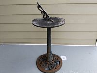 Full view of the sundial showing the base, post, and dial plate.