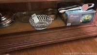 Wooden shelf holding a glass basket, German Spaetzle maker 'Spaetzle Fix', Romance punch set box and punch ladle