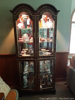 Front view of the china cabinet with glass doors, showcasing overall design and proportions