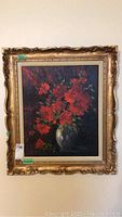 Full frontal view of framed floral painting