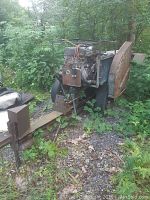 Front and side view of log splitter and saw combo showing steel frame, engine, wheels, saw blade