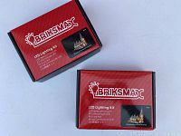 Two Briksmax branded red and black boxes of LED lighting kit displayed on a white background.