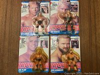Four figures still sealed in bubble packaging atop wooden surface: Lex Luger, Sid Vicious, Ric Flair and Arn Anderson