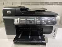 Front and top view of the HP Officejet Pro 8500 printer showing output tray and ADF.