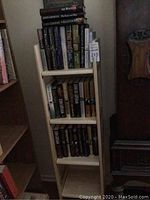 Bookcase with shelves filled with hardcover books
