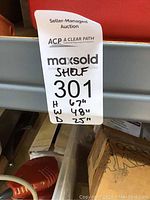 Metal utility shelving unit label showing height 67 inches, width 48 inches, depth 25 inches