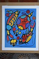 Full view of the unframed decorative print showing colorful animals and abstract shapes on blue background.