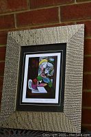 Full view of the framed print showing texture of the frame and the artwork centered inside double matting.