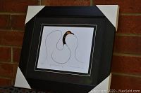 Full view of the professionally framed and matted art print "Goose Prepares to Fly" showing the stylized goose illustration and overall frame.