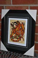 Full view of professionally framed and matted "Natures Balance" artwork by Norval Morrisseau wrapped at corners for protection.