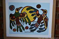 Full frontal photo of the 24 by 20 inch 'Thunderbird Sun Dance' art print showing colorful indigenous style thunderbird imagery.