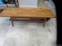 Front view of coffee table showing top surface and leg design