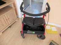 Front view of walker showing frame, seat and wheels