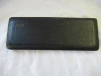 Closed black textured rectangular case with Riefler embossed logo on top