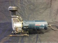 Side view of Bosch 1584VS electric jig saw showing model number and cord