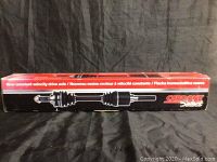 Boxed new constant velocity drive axle from Carbon Select with detailed branding on red and black box.