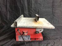 Frontal view of the Stay Sharp 7 inch bench top tile saw showing power switch and fence assembly.