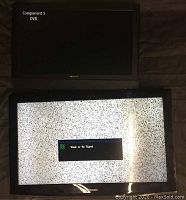 Both televisions shown powered on with screen displaying 'Component 1 DVD' on Sony TV and static with 'Weak or No Signal' on Samsung TV.