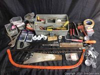 Full overview showing various hand tools including saws, clamps, hand drill, and hardware items.